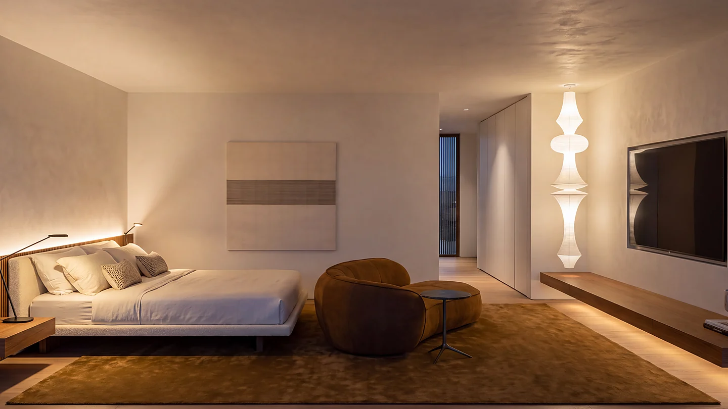 Suíte da Casa Maré em paleta neutra e iluminação quente